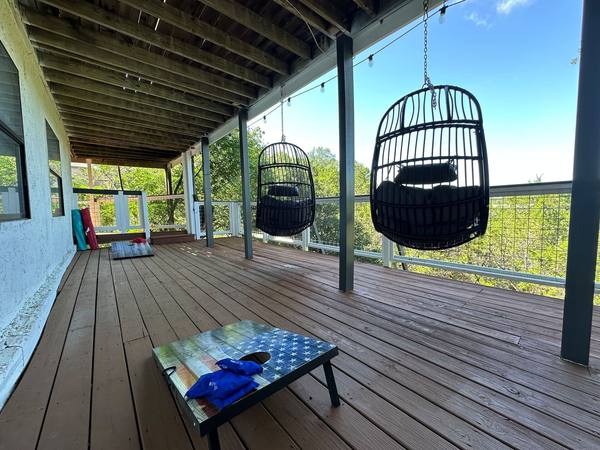 Lower deck with egg swings and cornhole